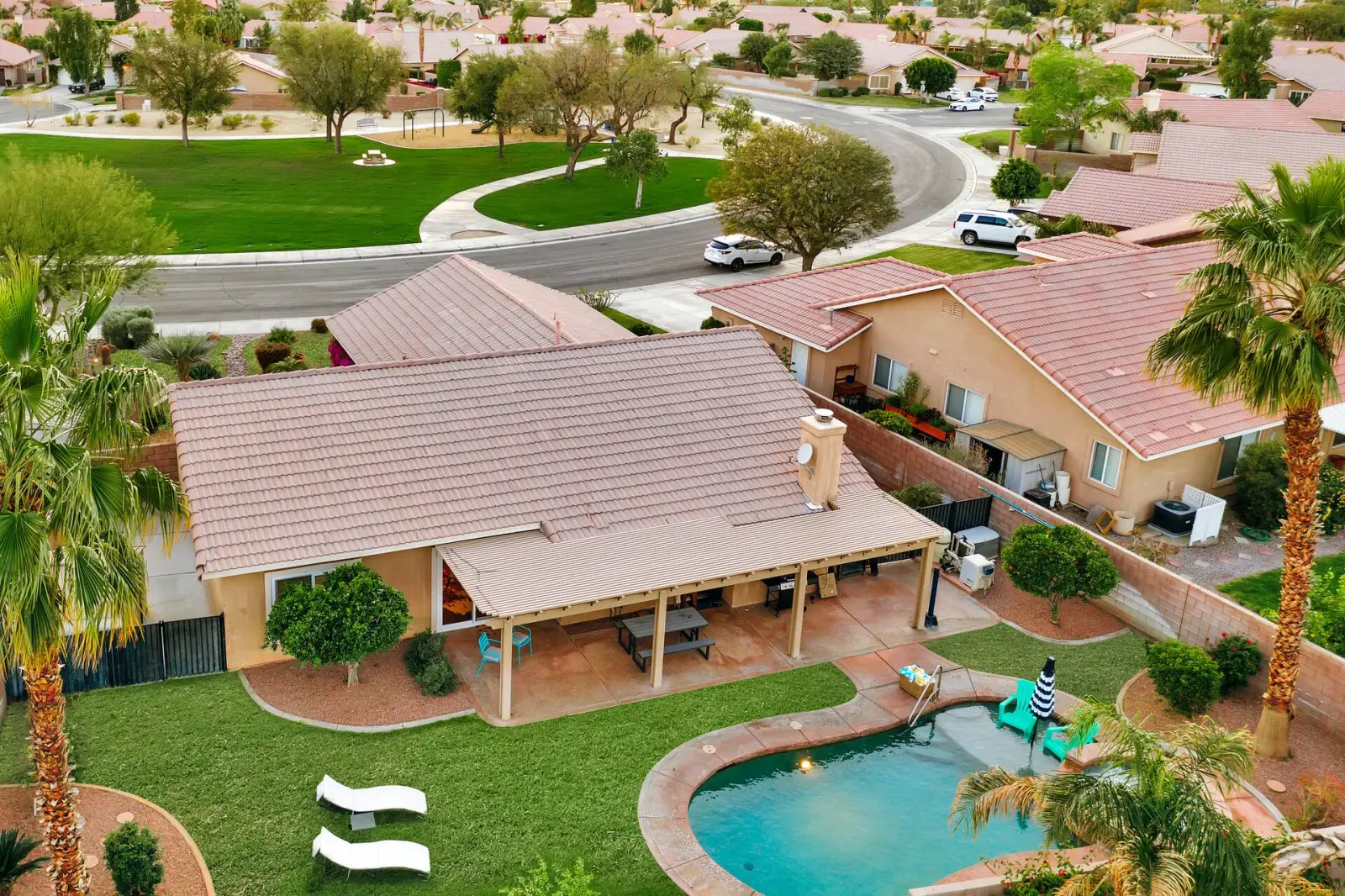 Aerial view of the home, pool and the park across the street