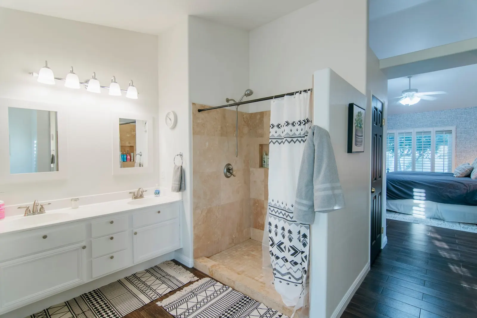 Bathroom with double vanity and walk-in shower