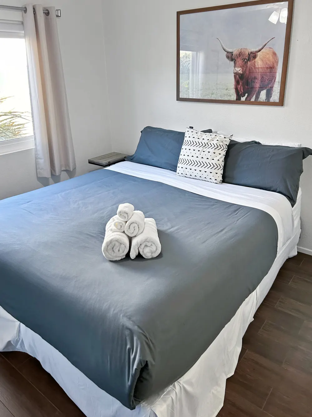 King bed made up with rolled towels