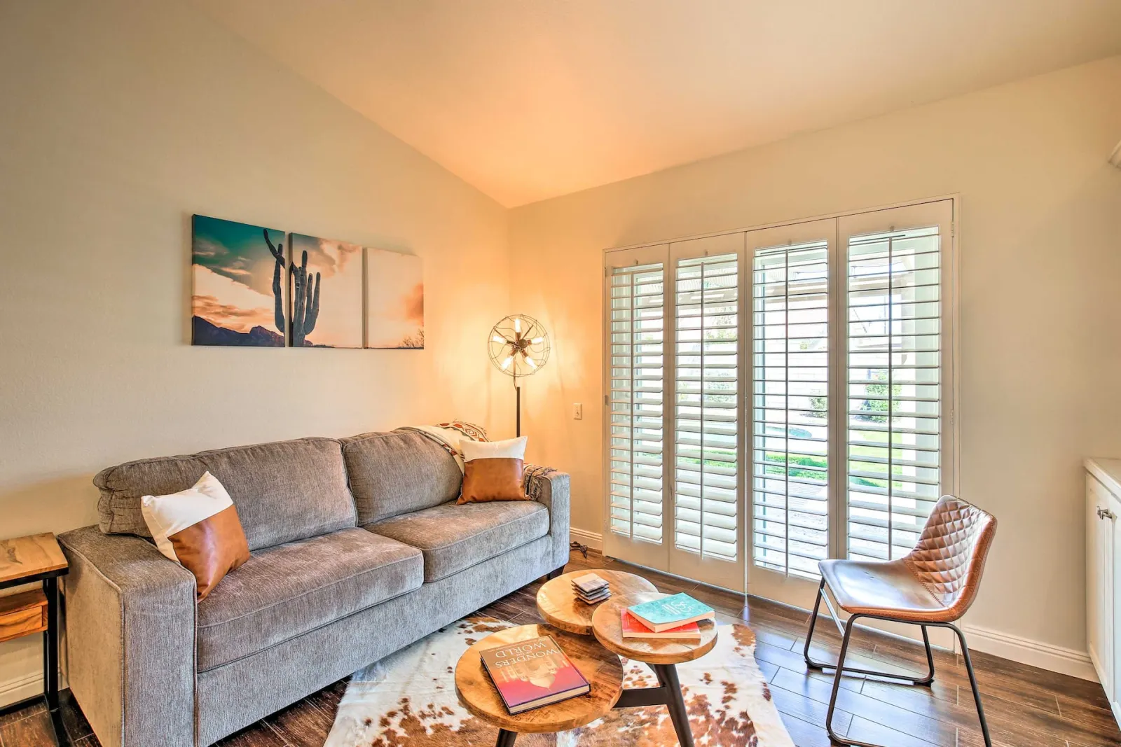 Second living area with sofa and shuttered windows