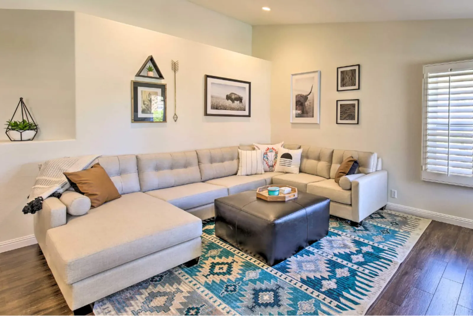 Living room with a large sectional and patterned rug